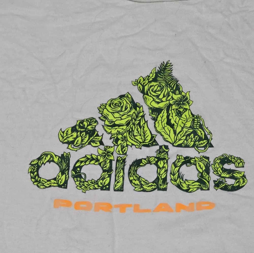 Adidas Gray Tee with Floral Logo and Orange Accent